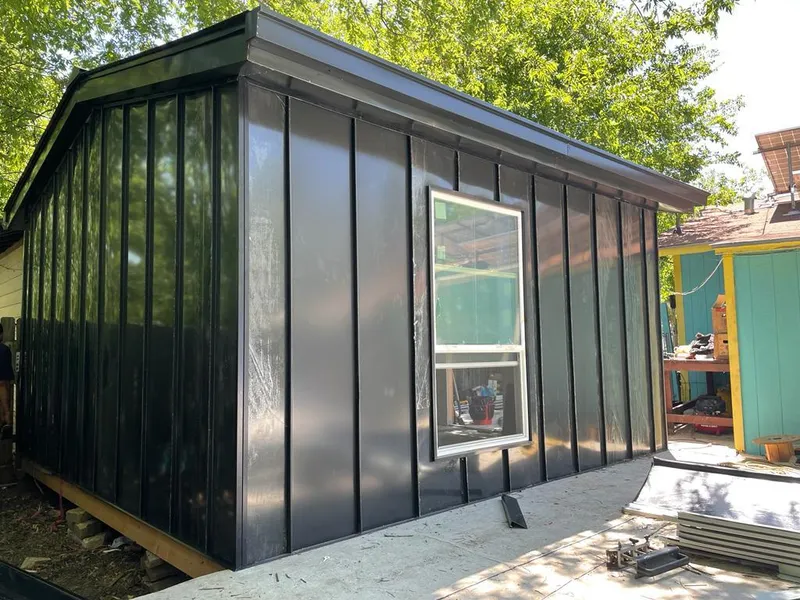 Black standing seam metal wall panels for Metal Roof Installation in Grinnell