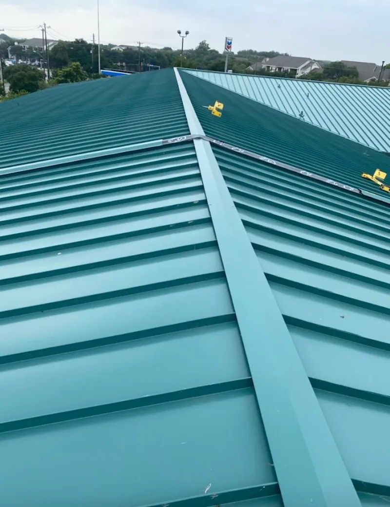 Green commercial metal roof ridge and valley for Metal Roof Repair in Grinnell